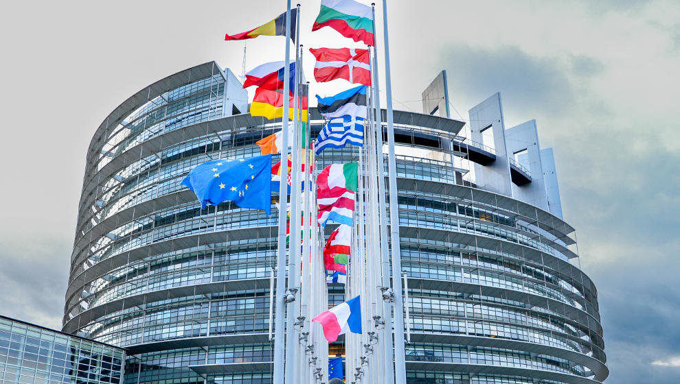 European flags at half-mast in front of the European Parliament building in Strasbourg in honour of former European Commission President Jacques Delors
